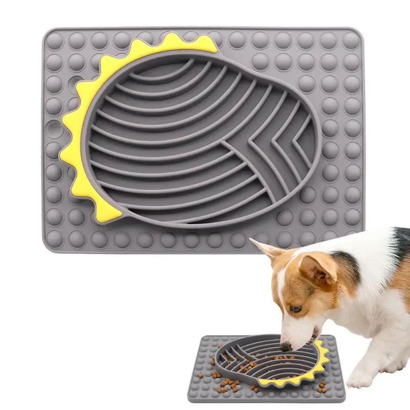Gray and yellow pet mat with a dog eating from it on a white background