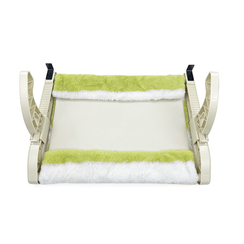 Pet bed with green and white striped cushion on a white background